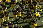 ANN ARBOR, MI - SEPTEMBER 19:  The Michigan Wolverines run on the field before the game against the Eastern Michigan Eagles at Michigan Stadium on September 19, 2009 in Ann Arbor, Michigan. Michigan won 45-17.  (Photo by Stephen Dunn/Getty Images)