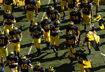 ANN ARBOR, MI - SEPTEMBER 19:  The Michigan Wolverines run on the field before the game against the Eastern Michigan Eagles at Michigan Stadium on September 19, 2009 in Ann Arbor, Michigan. Michigan won 45-17.  (Photo by Stephen Dunn/Getty Images)