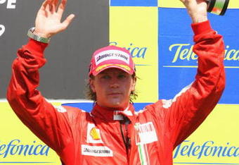 VALENCIA, SPAIN - AUGUST 23:  Kimi Raikkonen of Finland and Ferrari celebrates on the podium after finishing third in the European Formula One Grand Prix at the Valencia Street Circuit on August 23, 2009, in Valencia, Spain.  (Photo by Mark Thompson/Getty Images)