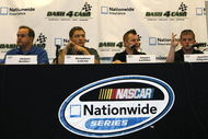 SPARTA, KY - JUNE 12:  (L-R) Jason Keller, driver of the #27 Cottonelle/Meijer Ford, Stephen Leicht, driver of the #29 Holiday Inn Chevrolet, Jason Leffler, driver of the #38 Great Clips Toyota and Justin Allgaier, driver of the #12 Verizon Wireless Dodge talk about the Nationwide 'Dash 4 Cash' program before practicing for the Meijer 300 Nationwide Series race at the Kentucky Speedway on June 12, 2009 in Sparta, Kentucky.  (Photo by John Sommers II/Getty Images)