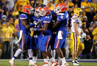 BATON ROUGE, LA - OCTOBER 10:  The defense of Florida Gators celebrate a stop against the Louisiana State University Tigers at Tiger Stadium on October 10, 2009 in Baton Rouge, Louisiana.  (Photo by Kevin C. Cox/Getty Images)