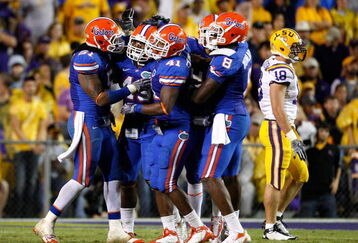 BATON ROUGE, LA - OCTOBER 10:  The defense of Florida Gators celebrate a stop against the Louisiana State University Tigers at Tiger Stadium on October 10, 2009 in Baton Rouge, Louisiana.  (Photo by Kevin C. Cox/Getty Images)