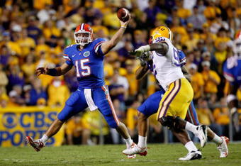 BATON ROUGE, LA - OCTOBER 10:  Quarterback Tim Tebow #15 of the Florida Gators scrambles as he throws a pass against the Louisiana State University Tigers at Tiger Stadium on October 10, 2009 in Baton Rouge, Louisiana.  (Photo by Kevin C. Cox/Getty Images)
