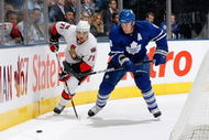 TORONTO - OCTOBER 6:  Nick Foligno #71 of the Ottawa Senators skates to the puck against Mike Komiserek #8 of the Toronto Maple Leafs during the game at Air Canada Centre on October 6, 2009 in Toronto, Ontario, Canada. (Photo by Dave Sandford/Getty Images)