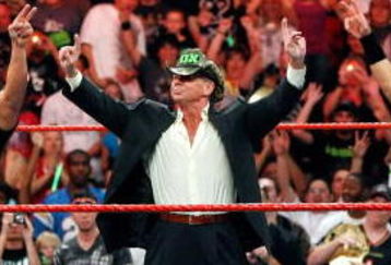 LAS VEGAS - AUGUST 24:  (L-R) Wrestler Triple H, World Wrestling Entertainment Inc. Chairman Vince McMahon and wrestler Shawn Michaels appear in the ring during the WWE Monday Night Raw show at the Thomas & Mack Center August 24, 2009 in Las Vegas, Nevada.  (Photo by Ethan Miller/Getty Images)