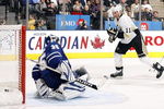 TORONTO - OCTOBER 10:  Vesa Toskala #35 of the Toronto Maple Leafs lets one go through his legs (Shot by Sergei Gonchar) as Jordan Staal #11 of the Pittsburgh Penguins looks on during a NHL game at the Air Canada Centre on October 10, 2009 in Toronto, Ontario, Canada .  (Photo by Abelimages/Getty Images)