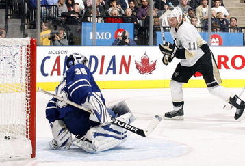 TORONTO - OCTOBER 10:  Vesa Toskala #35 of the Toronto Maple Leafs lets one go through his legs (Shot by Sergei Gonchar) as Jordan Staal #11 of the Pittsburgh Penguins looks on during a NHL game at the Air Canada Centre on October 10, 2009 in Toronto, Ontario, Canada .  (Photo by Abelimages/Getty Images)