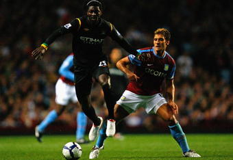 BIRMINGHAM, ENGLAND - OCTOBER 05:  Emmanuel Adebayor of Manchester City is challenged by Stiliyan Petrov of Aston Villa during the Barclays Premier League match between Aston Villa and Manchester City at Villa Park on October 5, 2009 in Birmingham, England.  (Photo by Clive Rose/Getty Images)