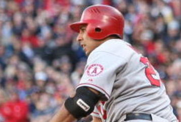 BOSTON - OCTOBER 11: Juan Rivera #20 of the Los Angeles Angels of Anaheim grounded out to score Torii Hunter #48 in the sixth inning of Game Three of the ALDS against the Boston Red Sox during the 2009 MLB Playoffs at Fenway Park on October 11, 2009 in Boston, Massachusetts.  (Photo by Elsa/Getty Images)