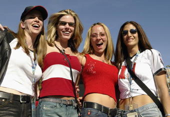 SAN DIEGO - JANUARY 26:  Four female Tampa Bay Buccaneers fans pose for a picture outside the stadium in the sunshine before the start of Super Bowl XXXVII between the Oakland Raiders and the Tampa Bay Buccaneers on January 26, 2003 at Qualcomm Stadium in San Diego, California. The Buccaneers defeated the Raiders 48-21. (Photo by Brian Bahr/Getty Images)