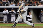 NEW YORK - OCTOBER 09:  Joe Mauer #7 of the Minnesota Twins hits a foul ball in the eleventh inning  against the New York Yankees in Game Two of the ALDS during the 2009 MLB Playoffs at Yankee Stadium on October 9, 2009 in the Bronx borough of New York City.  (Photo by Jim McIsaac/Getty Images)