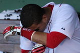 BOSTON - OCTOBER 11:  Cacther Victor Martinez #41 of the Boston Red Sox sits in the dugout after losing to the Los Angeles Angels of Anaheim 7-6 in Game Three of the ALDS during the 2009 MLB Playoffs at Fenway Park on October 11, 2009 in Boston,  Massachusetts. (Photo by Jim Rogash/Getty Images)