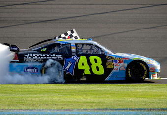 FONTANA, CA - OCTOBER 11:  Jimmie Johnson, driver of the #48 Lowe's Chevrolet, performs a burnout to celebrate winning the NASCAR Sprint Cup Series Pepsi 500 at Auto Club Speedway on October 11, 2009 in Fontana, California.  (Photo by Rusty Jarrett/Getty Images for NASCAR)