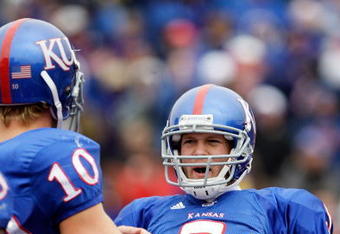 LAWRENCE, KS - OCTOBER 10:  Quarterback Todd Reesing #5 of the Kansas Jayhawks velebrates with Kerry Meier #10 after rushing for a touchdown during the game against the Iowa State Cyclones on October 10, 2009 at Memorial Stadium in Lawrence, Kansas.  (Photo by Jamie Squire/Getty Images)