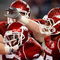 ARLINGTON, TX - OCTOBER 03:  Wide receiver Jarius Wright #4 of the Arkansas Razorbacks celebrates a touchdown pass reception against the Texas A&M Aggies at Dallas Cowboys Stadium on October 3, 2009 in Arlington, Texas.  (Photo by Ronald Martinez/Getty Images)