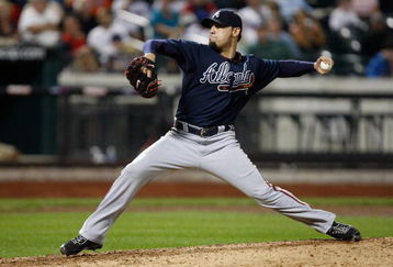 NEW YORK - SEPTEMBER 23:  Mike Gonzalez #51 of the Atlanta Braves pitches against the New York Mets during the game on September 23, 2009 at Citi Field in the Flushing neighborhood of the Queens borough of New York City.  (Photo by Jared Wickerham/Getty Images)