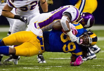 ST. LOUIS, MO - OCTOBER 11: Steven Jackson #39 of the St. Louis Rams is tackled against the Minnesota Vikings at the Edward Jones Dome on October 11, 2009 in St. Louis, Missouri.  (Photo by Dilip Vishwanat/Getty Images)
