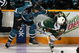 SAN JOSE, CA - OCTOBER 10: Douglas Murray #3 of the San Jose Sharks and Cal Clutterbuck #22 of the Minnesota Wild go for the puck at HP Pavilion on October 10, 2009 in San Jose, California. (Photo by Ezra Shaw/Getty Images)