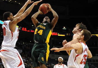 OKLAHOMA CITY - MARCH 11: Guard LaceDarius Dunn #24 of the Baylor Bears takes a shot against Toney McCray #30 of the Nebraska Cornhuskers during the Phillips 66 Big 12 Men's Basketball Championship at the Ford Center March 11, 2009 in Oklahoma City, Oklahoma.  (Photo by Ronald Martinez/Getty Images)