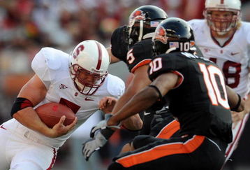 CORVALLIS, OR - OCTOBER 10: Stanford running back Toby Gerhart #7 of the Stanford Cardinals looks for some running room as safety Cameron Collins #5 and safety Lance Mitchell #10 of the Oregon State Beaver close in during the first quarter of the game at Reser Stadium on October 10, 2009 in Corvallis, Oregon. (Photo by Steve Dykes/Getty Images)