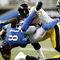 DETROIT , MI - OCTOBER 11:  Calvin Johnson #81 of the Detroit Lions is tackled by James Harrison #92 of the  Pittsburgh Steelers October 11, 2009 at Ford Field in Detroit, Michigan. Johnson was injured on the play.  (Photo by Gregory Shamus/Getty Images)