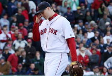 BOSTON - OCTOBER 11: Pitcher Jonathan Papelbon #58 of the Boston Red Sox reacts after being taken out of the game after blowing a save in the ninth inning against the Los Angeles Angels of Anaheim in Game Three of the ALDS during the 2009 MLB Playoffs at Fenway Park on October 11, 2009 in Boston, Massachusetts. The Angels defeated the Red Sox 7-6. (Photo by Jim Rogash/Getty Images)
