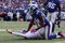 EAST RUTHERFORD, NJ - OCTOBER 11:  Mathias Kiwanuka #94 of the New York Giants forces a fumble against JaMarcus Russell #2 of the Oakland Raiders on October 11, 2009 at Giants Stadium in East Rutherford, New Jersey. The Giants defeated the Raiders 44-7.  (Photo by Jim McIsaac/Getty Images)