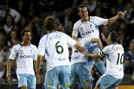 MELBOURNE, AUSTRALIA - OCTOBER 09:  Sydney FC players celebrate a goal by Mark Bridge during the round ten A-League match between the Melbourne Victory and Sydney FC at Etihad Stadium on October 9, 2009 in Melbourne, Australia.  (Photo by Quinn Rooney/Getty Images)