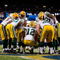 ST. LOUIS, MO - SEPTEMBER 27:  Aaron Rodgers #12 of the Green Bay Packers huddles with the offense during the game against the St. Louis Rams at the Edward Jones Dome on September 27, 2009 in St. Louis, Missouri.  (Photo by Dilip Vishwanat/Getty Images)