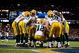 ST. LOUIS, MO - SEPTEMBER 27: Aaron Rodgers #12 of the Green Bay Packers huddles with the offense during the game against the St. Louis Rams at the Edward Jones Dome on September 27, 2009 in St. Louis, Missouri. (Photo by Dilip Vishwanat/Getty Images)