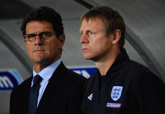 DNEPROPETROVSK, UKRAINE - OCTOBER 10: England manager, Fabio Capello stands with assistant Stuart Pearce during the FIFA 2010 World Cup Group 6 Qualifying match between Ukraine and England at the Dnipro Arena on October 10, 2009 in Dnepropetrovsk, Ukraine.  (Photo by Michael Regan/Getty Images)
