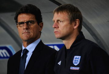 DNEPROPETROVSK, UKRAINE - OCTOBER 10: England manager, Fabio Capello stands with assistant Stuart Pearce during the FIFA 2010 World Cup Group 6 Qualifying match between Ukraine and England at the Dnipro Arena on October 10, 2009 in Dnepropetrovsk, Ukraine.  (Photo by Michael Regan/Getty Images)