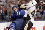 TORONTO - OCTOBER 10:  Jason Blake #55 of the Toronto Maple Leafs is taken into the boards by Brooks Orpik #44 of the Pittsburgh Penguins during a NHL game at the Air Canada Centre on October 10, 2009 in Toronto, Ontario, Canada .  (Photo by Abelimages/Getty Images)