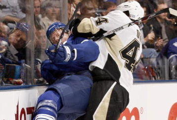 TORONTO - OCTOBER 10:  Jason Blake #55 of the Toronto Maple Leafs is taken into the boards by Brooks Orpik #44 of the Pittsburgh Penguins during a NHL game at the Air Canada Centre on October 10, 2009 in Toronto, Ontario, Canada .  (Photo by Abelimages/Getty Images)