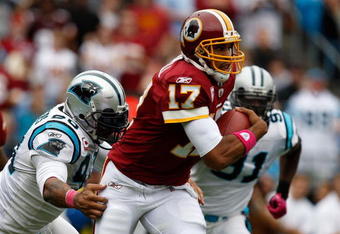 CHARLOTTE, NC - OCTOBER 11:  Jason Campbell #17 of Washington Redskins gets away from Julius Peppers #90 of the Carolina Panthers at Bank of America Stadium on October 11, 2009 in Charlotte, North Carolina.  (Photo by Streeter Lecka/Getty Images)