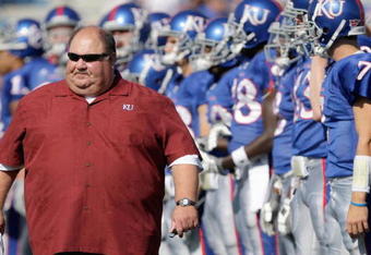 LAWRENCE, KS - SEPTEMBER 19:  Head coach Mark Mangino of the Kansas Jayhawks walk on the field before the game against the Duke Blue Devils on Kivisto Field at Memorial Stadium on September 19, 2009 in Lawrence, Kansas. (Photo by Jamie Squire/Getty Images)