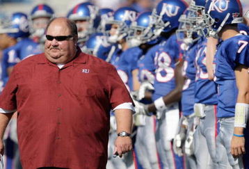LAWRENCE, KS - SEPTEMBER 19:  Head coach Mark Mangino of the Kansas Jayhawks walk on the field before the game against the Duke Blue Devils on Kivisto Field at Memorial Stadium on September 19, 2009 in Lawrence, Kansas. (Photo by Jamie Squire/Getty Images)