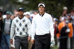 SAN FRANCISCO - OCTOBER 10: Ryo Ishikawa of Japan and the International Team walks from the 6th tee followed by Tiger Woods of the USA Team during the Day Three Afternoon Fourball Matches in The Presidents Cup at Harding Park Golf Course on October 10, 2009 in San Francisco, California  (Photo by David Cannon/Getty Images)