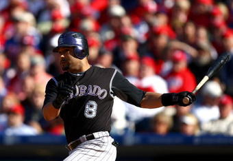 PHILADELPHIA - OCTOBER 07:  Yorvit Torrealba #8 of the Colorado Rockies hits a double in the bottom of the second inning against the Philadelphia Phillies in Game One of the NLDS during the 2009 MLB Playoffs at Citizens Bank Park on October 7, 2009 in Philadelphia, Pennsylvania. The Phillies won 5-1. (Photo by Chris McGrath/Getty Images)