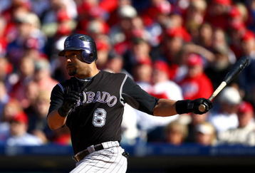 PHILADELPHIA - OCTOBER 07:  Yorvit Torrealba #8 of the Colorado Rockies hits a double in the bottom of the second inning against the Philadelphia Phillies in Game One of the NLDS during the 2009 MLB Playoffs at Citizens Bank Park on October 7, 2009 in Philadelphia, Pennsylvania. The Phillies won 5-1. (Photo by Chris McGrath/Getty Images)