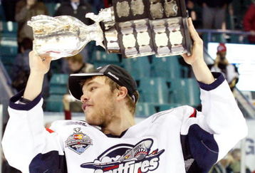 RIMOUSKI, QC - MAY 24:   Taylor Hall #4 of the Windsor Spitfires raises the Memorial Cup after defeating the Kelowna Rockets during the 2009 Mastercard Memorial Cup Final at the Rimouski Colisee on May 24, 2009 in Rimouski, Quebec, Canada.  The Spitfires defeated the Rockets 4-1 winning the 2009 Memorial Cup.  (Photo by Richard Wolowicz/Getty Images)