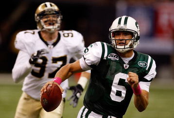 NEW ORLEANS - OCTOBER 04:  Quarterback Mark Sanchez #6 of the New York Jets scrambles away from Jeff Charleston #97 of the New Orleans Saints at the Louisana Superdome on October 4, 2009 in New Orleans, Louisiana.  (Photo by Chris Graythen/Getty Images)