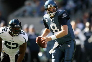 SEATTLE - OCTOBER 11:  Quarterback Matt Hasselbeck #8 of the Seattle Seahawks scrambles against linebacker Daryl Smith #52 of the Jacksonville Jaguars on October 11, 2009 at Qwest Field in Seattle, Washington. The Seahawks defeated the Jaguars 41-0. (Photo by Otto Greule Jr/Getty Images)