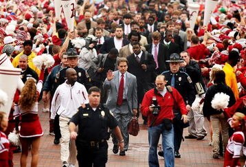 TUSCALOOSA, FL - NOVEMBER 29:  Head coach Nick Saban of the Alabama Crimson Tide waves to fans during the walk of champions before taking on the Auburn Tigers at Bryant-Denny Stadium on November 29, 2008 in Tuscaloosa, Alabama.  (Photo by Doug Benc/Getty Images)
