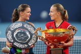BEIJING - OCTOBER 11:  Winner Svetlana Kuznetsova (R) of Russia and opponent Agnieszka Radwanska of Poland pose with their trophies after competing in the women's final match during day ten of the 2009 China Open at the National Tennis Centre on October 11, 2009 in Beijing, China. Svetlana Kuznetsova of Russia wins the tournament.   (Photo by Feng Li/Getty Images)