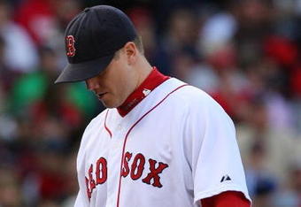 BOSTON - OCTOBER 11:  Pitcher Jonathan Papelbon #58 of the Boston Red Sox reacts after allowing three runs in the ninth inning to blow the save against the Los Angeles Angels of Anaheim in Game Three of the ALDS during the 2009 MLB Playoffs at Fenway Park on October 11, 2009 in Boston,  Massachusetts. (Photo by Jim Rogash/Getty Images)