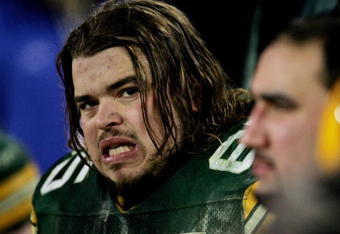 GREEN BAY, WI - JANUARY 9:  Tackle Mark Tauscher #65 of the Green Bay Packers watches from the sidelines as his team is eliminated from the playoffs by the Minnesota Vikings in the NFC wild-card game at Lambeau Field January 9, 2005 in Green Bay, Wisconsin. The Vikings defeated the Packers 31-17.  (Photo by Jonathan Daniel/Getty Images)