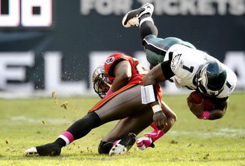 PHILADELPHIA - OCTOBER 11:  Michael Vick #7 of the Philadelphia Eagles collides with Aqib Talib #25 of the Tampa Bay Buccaneers at Lincoln Financial Field on October 11, 2009 in Philadelphia, Pennsylvania.  (Photo by Jeff Zelevansky/Getty Images)