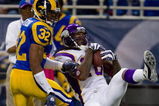 ST. LOUIS, MO - OCTOBER 11: Sidney Rice #18 of the Minnesota Vikings hauls in a pass against Bradley Fletcher #32 of the St. Louis Rams at the Edward Jones Dome on October 11, 2009 in St. Louis, Missouri.  The Vikings beat the Rams 38-10.  (Photo by Dilip Vishwanat/Getty Images)