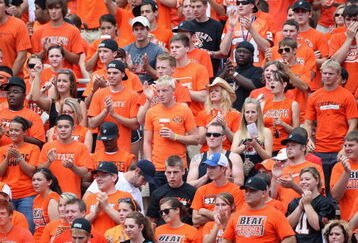 STILLWATER, OK - SEPTEMBER 05:  Fans of the Oklahoma State Cowboys cheers during the college football game against the Georgia Bulldogs at Boone Pickens Stadium on September 5, 2009 in Stillwater, Oklahoma.  The Cowboys defeated the Bulldogs 24-10.  (Photo by Christian Petersen/Getty Images)